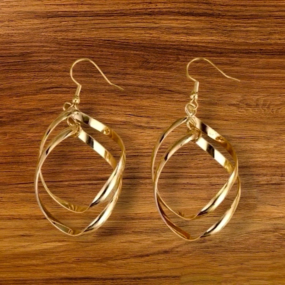 New gold tone intertwined hoop earrings